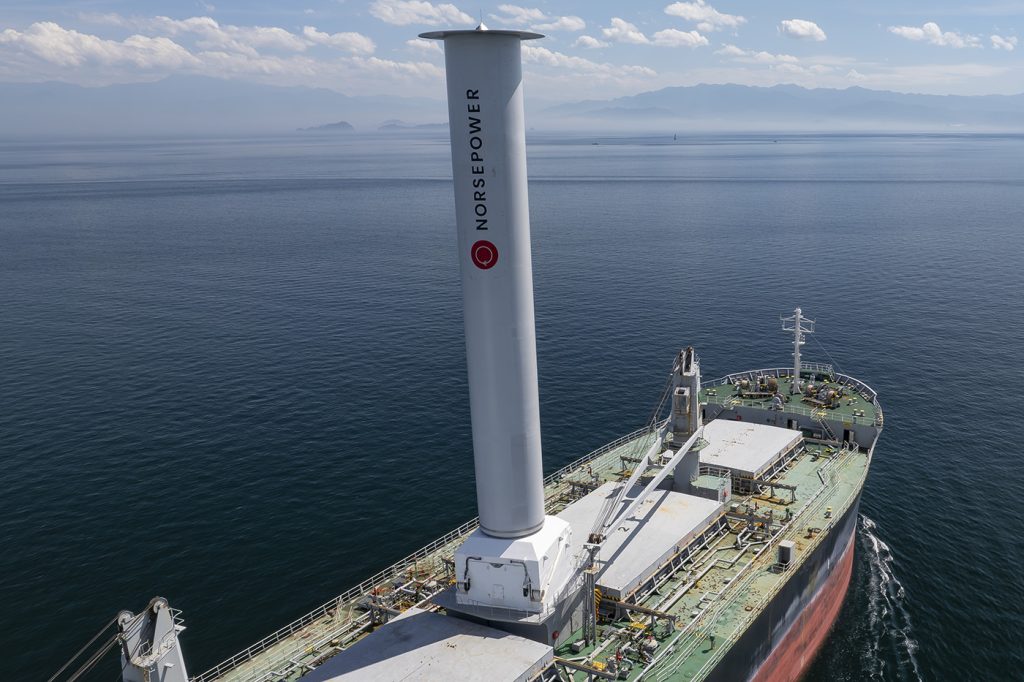 photo of a ship showing a large rotor sail on deck